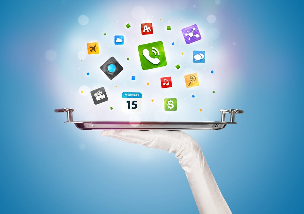 A stylish waiter hand with white gloves holding a silver plate full of social media communication icons and symbols in front of blue background