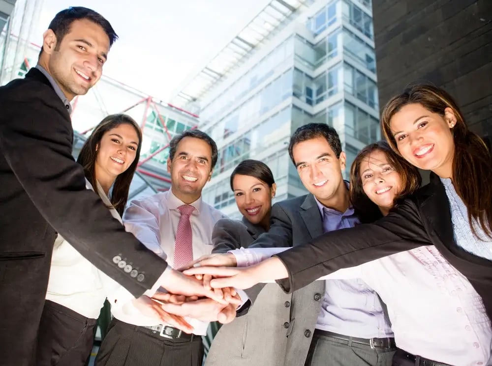 Business team with hands together - teamwork concepts