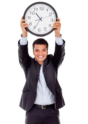 Businessman holding a clock - isolated over a white background