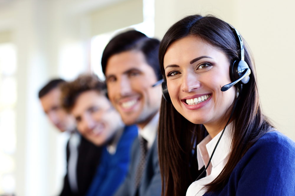 Cheerful young businesspeople and colleagues in a call center office-1