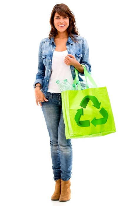 Ecological woman with a green bag - isolated over white