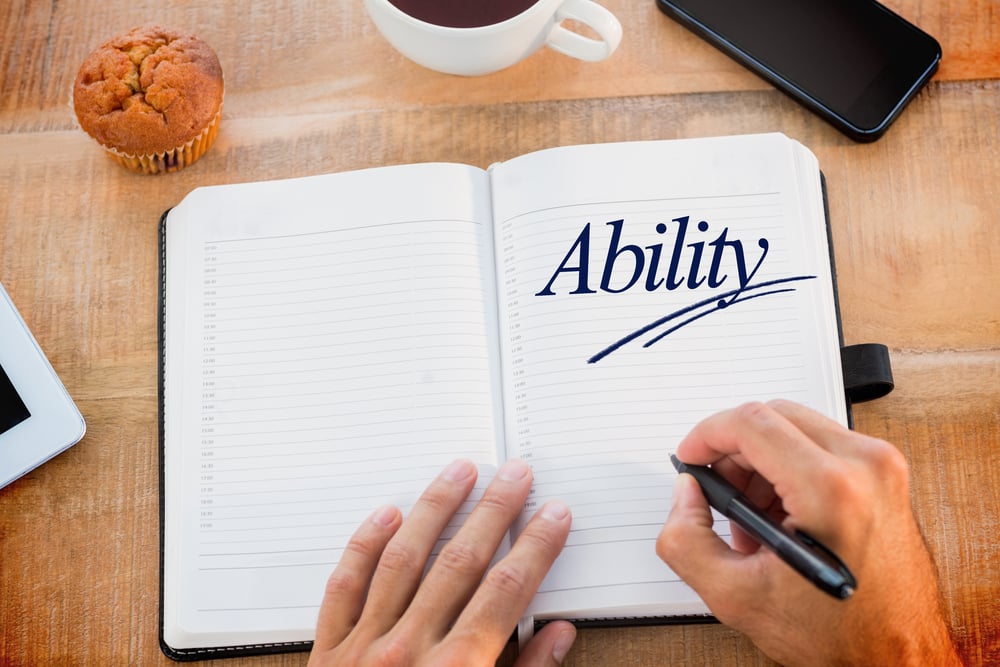 The word ability against man writing notes on diary