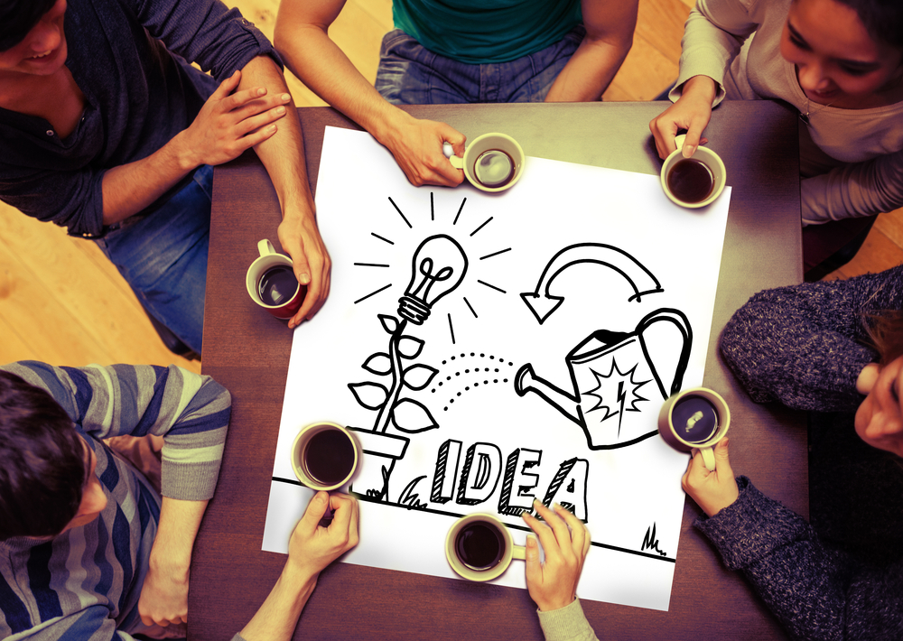 Composite image of idea and innovation graphic on page with people sitting around table drinking coffee-2
