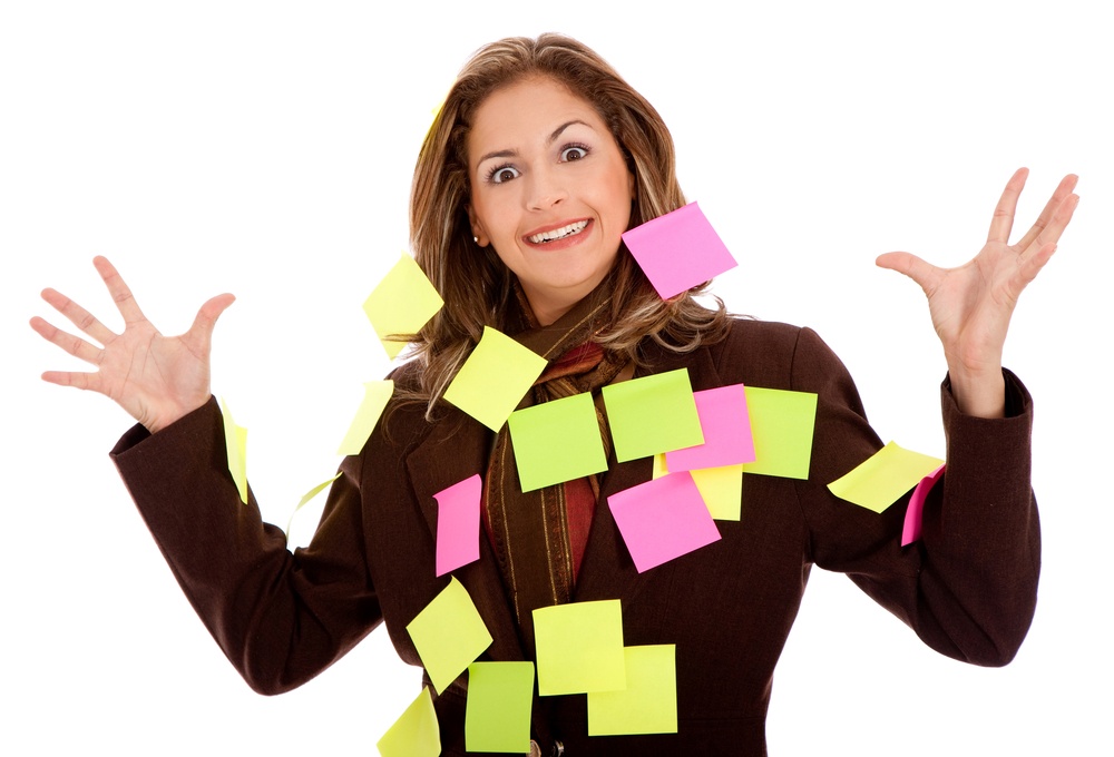 mulitasking business woman with post-its, isolated over a white background